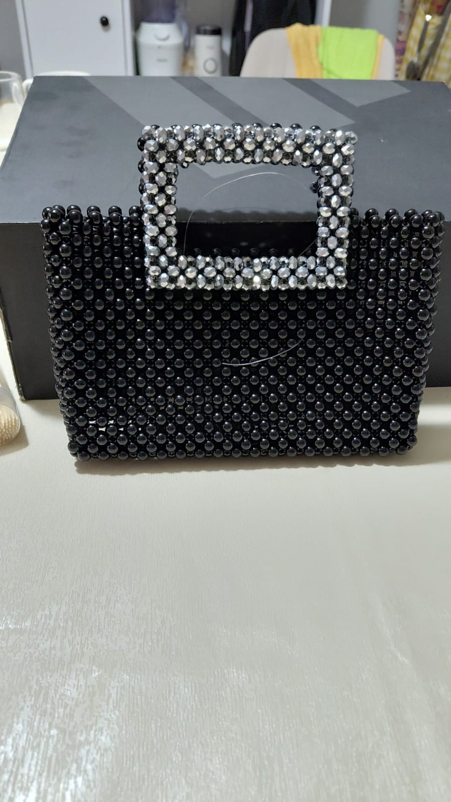 Delour Noir Crystal — a black beaded evening bag with a crystal-set handle